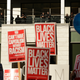 Police officers watch from a shopping mall balcony as a Black Lives Matter protest occurs below on Black Friday in Seattle on Nov. 27, 2015.
JASON REDMOND/AFP/Getty Images